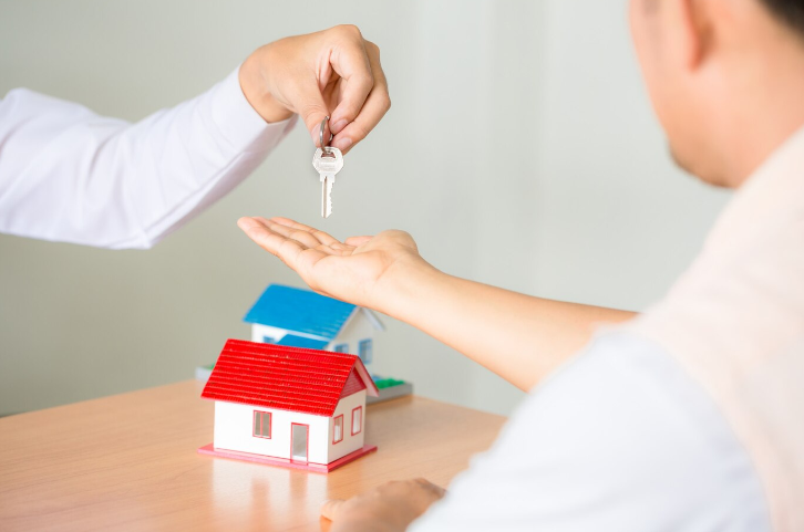 Realtor Giving Keys to a Client